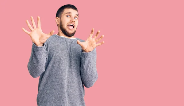 Young Handsome Man Wearing Casual Sweater Afraid Terrified Fear Expression — Stock Photo, Image