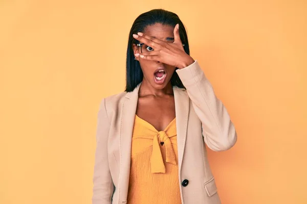 Young African American Woman Wearing Business Clothes Peeking Shock Covering — Stock Photo, Image