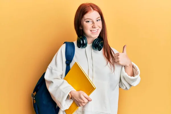 Young Red Head Girl Wearing Student Backpack Holding Book Smiling — Stock Photo, Image