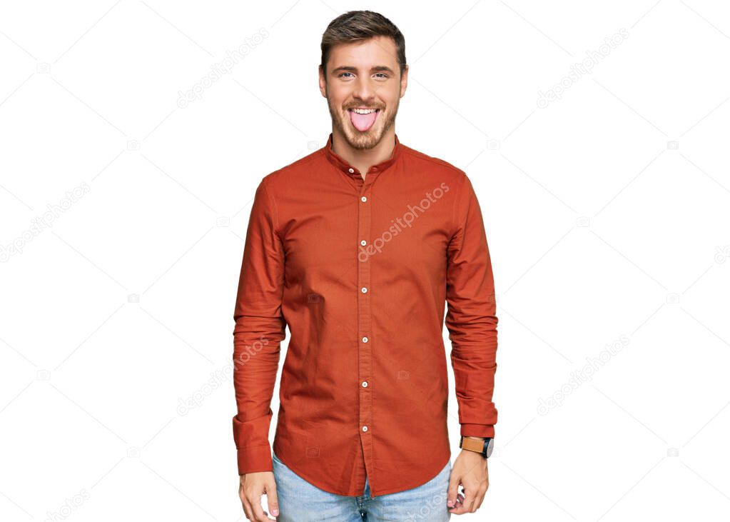 Handsome caucasian man wearing casual clothes sticking tongue out happy with funny expression. emotion concept. 