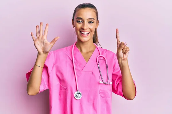 Young Hispanic Woman Wearing Doctor Uniform Stethoscope Showing Pointing Fingers — Stok fotoğraf