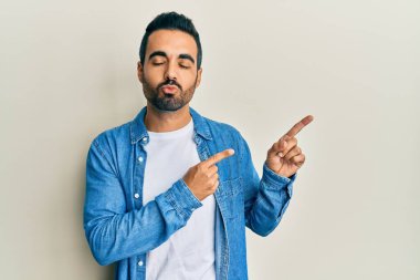 Sakallı genç ve sakallı bir adam. Depresyonda ve üzüntüden ağlıyor. Kızgın ve korkmuş. hüzünlü ifade. 