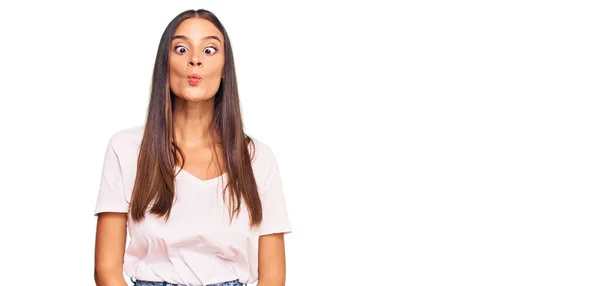 Young Hispanic Woman Wearing Casual White Tshirt Making Fish Face — Stock Photo, Image