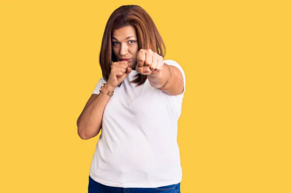 Middle Age Latin Woman Wearing Casual White Tshirt Punching Fist — Foto Stock