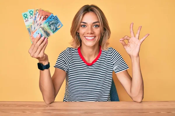 Beautiful Caucasian Woman Holding Australian Dollars Doing Sign Fingers Smiling — Stock Photo, Image