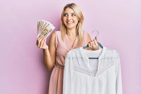 Young Caucasian Woman Holding Hanger Shirt Russian Ruble Banknotes Smiling — Stock Photo, Image