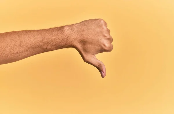 Arm Hand Caucasian Man Yellow Isolated Background Doing Thumbs Rejection — Stock Photo, Image