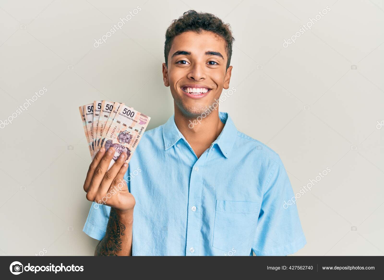 Young Handsome African American Man Holding 500 Mexican Pesos Banknotes —  Stock Photo © Krakenimages.com #427562740