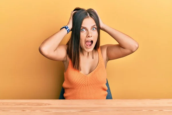 Young Caucasian Woman Wearing Casual Clothes Sitting Table Crazy Scared — Stock Photo, Image