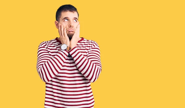 Young Handsome Man Wearing Striped Sweater Tired Hands Covering Face — Stock Photo, Image