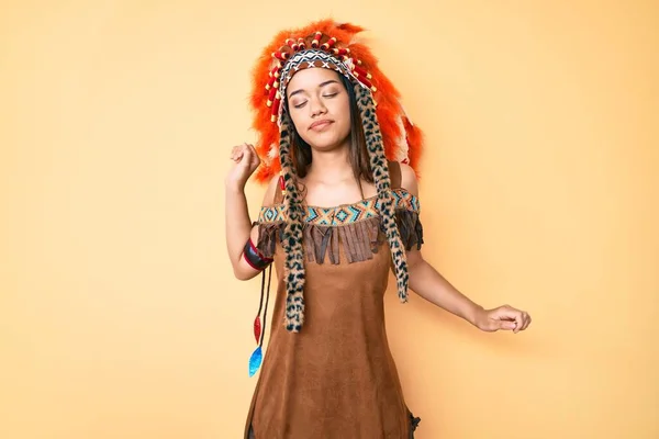 Young Beautiful Latin Girl Wearing Indian Costume Stretching Back Tired — Stock Photo, Image