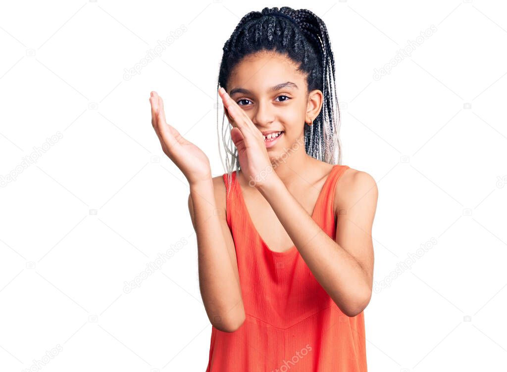 Cute african american girl wearing casual clothes clapping and applauding happy and joyful, smiling proud hands together 