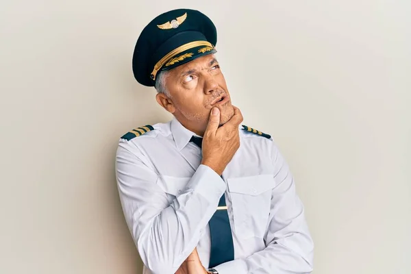 Handsome Middle Age Mature Man Wearing Airplane Pilot Uniform Thinking — Stock Photo, Image