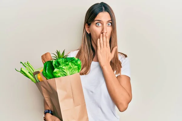 Brunette Young Woman Holding Paper Bag Bread Groceries Covering Mouth — Stock Photo, Image