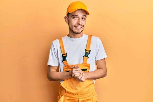 Joven Hispano Vestido Con Uniforme Manitas Escéptico Nervioso Desaprobando Expresión —  Fotos de Stock