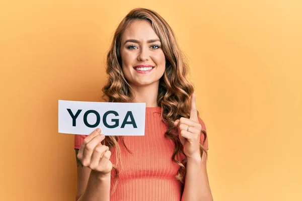 Young Blonde Girl Holding Yoga Message Paper Smiling Idea Question — Stock Photo, Image