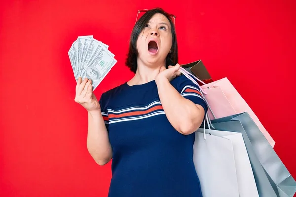 Brunette Woman Syndrome Holding Shopping Bags Dollars Angry Mad Screaming — Fotografia de Stock