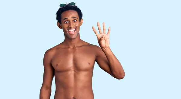 African Handsome Man Wearing Swimsuit Sunglasses Showing Pointing Fingers Number — Stock Photo, Image