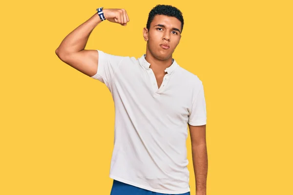 Young Arab Man Wearing Casual Clothes Strong Person Showing Arm — Stock Photo, Image