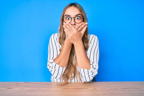 Young Beautiful Blonde Woman Wearing Glasses Sitting Table Shocked Covering — Stock Photo, Image