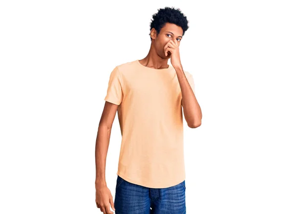 Young African American Man Wearing Casual Clothes Smelling Something Stinky — Stock Photo, Image
