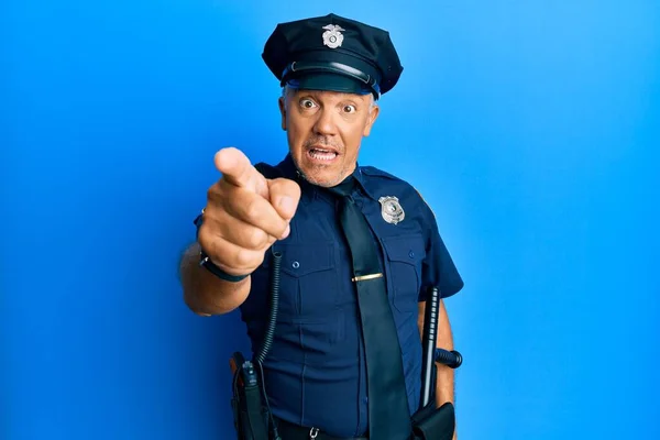 Handsome middle age mature man wearing police uniform pointing displeased and frustrated to the camera, angry and furious with you