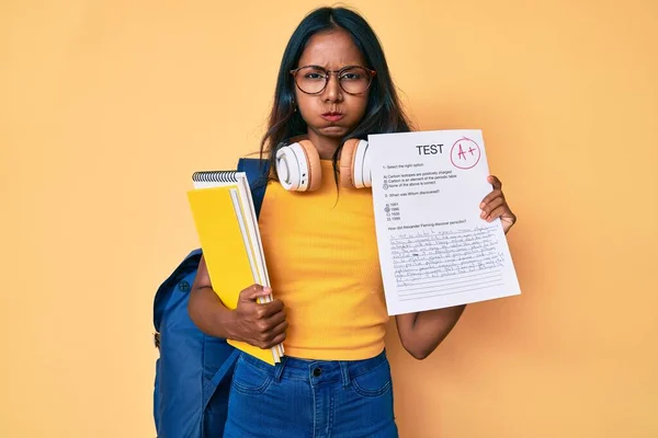 Young Indian Girl Wearing Backpack Showing Passed Exam Puffing Cheeks — Stockfoto