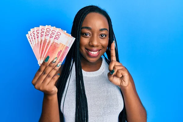 Young African American Woman Holding 100 Norwegian Krone Banknotes Smiling —  Fotos de Stock