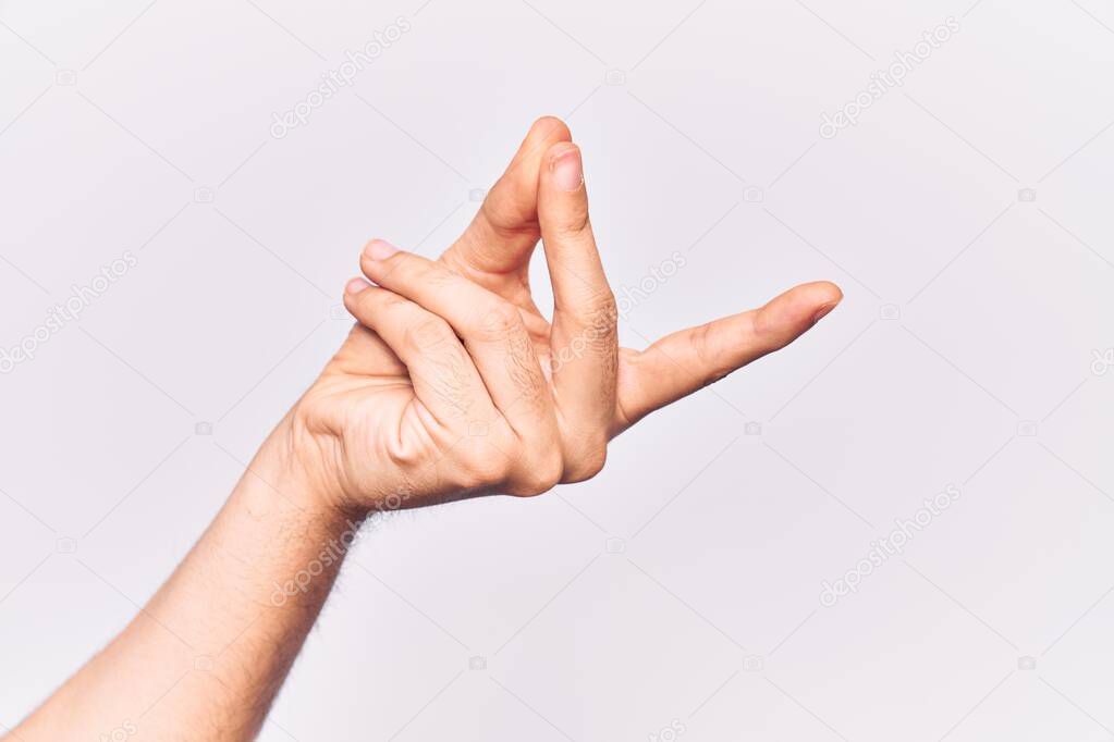 Close up of hand of young caucasian man over isolated background snapping fingers for success, easy and click symbol gesture with hand 