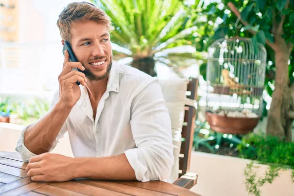 Handsome Caucasian Man Sitting Terrace Home Smiling Happy Speaking Phone — Stock Photo, Image