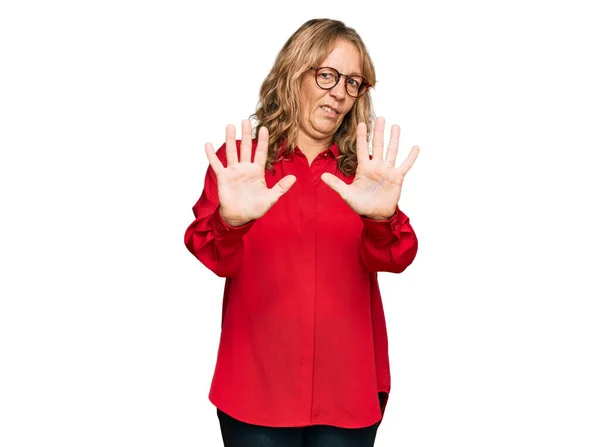 Middle Age Blonde Woman Wearing Casual Shirt Red Background Afraid — Stock Photo, Image