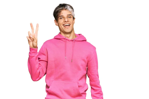 Junger Hispanischer Mann Lässigem Rosafarbenem Sweatshirt Lächelt Mit Glücklichem Gesicht — Stockfoto