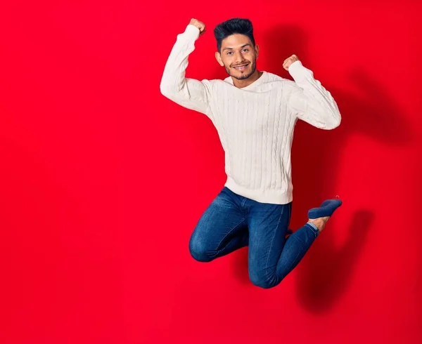 Young Handsome Latin Man Wearing Casual Clothes Smiling Happy Jumping — Stock Photo, Image