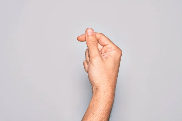 Mano Joven Caucásico Mostrando Dedos Sobre Fondo Blanco Aislado Sosteniendo —  Fotos de Stock