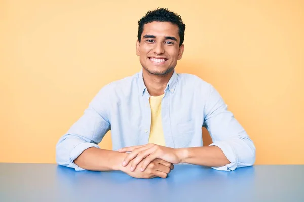 Young Handsome Hispanic Man Wearing Casual Clothes Sitting Table Looking — Stock Photo, Image