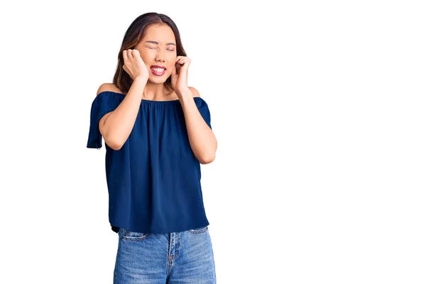 Young Beautiful Chinese Girl Wearing Casual Clothes Covering Ears Fingers — Stock Photo, Image