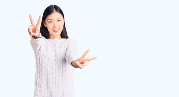 Jonge Mooie Chinese Vrouw Draagt Casual Trui Glimlachend Met Tong — Stockfoto