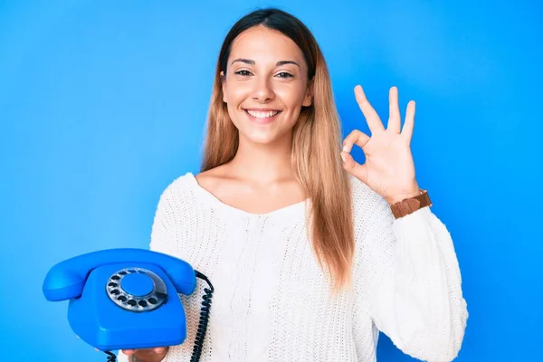Young Brunette Woman Using Vintage Telephone Doing Sign Fingers Smiling — Stock Photo, Image