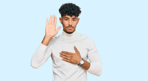 Young Arab Man Wearing Casual Winter Sweater Swearing Hand Chest — Stock Photo, Image