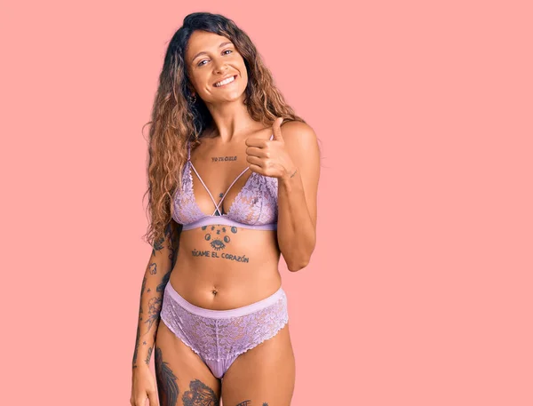 Young Hispanic Woman Tattoo Wearing Lingerie Doing Happy Thumbs Gesture — Stock Photo, Image