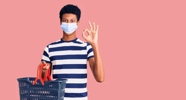 Young African American Man Wearing Shopping Basket Medical Mask Doing — Stock Photo, Image