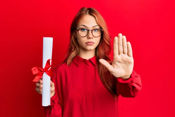 Young Redhead Woman Holding Graduate Degree Diploma Open Hand Doing — Stock Photo, Image