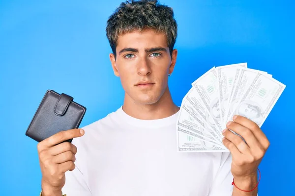 Young Handsome Man Holding Wallet Dollars Banknotes Relaxed Serious Expression — Stock Photo, Image