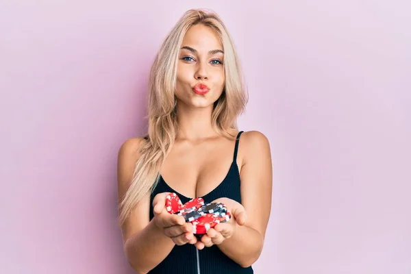 Beautiful Caucasian Blonde Girl Holding Casino Chips Looking Camera Blowing — Stock Photo, Image