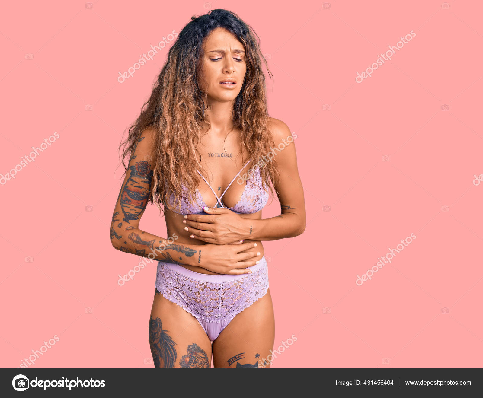 Young Hispanic Woman Tattoo Wearing Lingerie Hand Stomach Because  Indigestion Stock Photo by ©Krakenimages.com 431456404