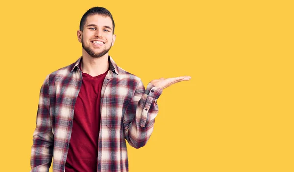 Young Handsome Man Wearing Casual Shirt Smiling Cheerful Presenting Pointing — Stock Photo, Image