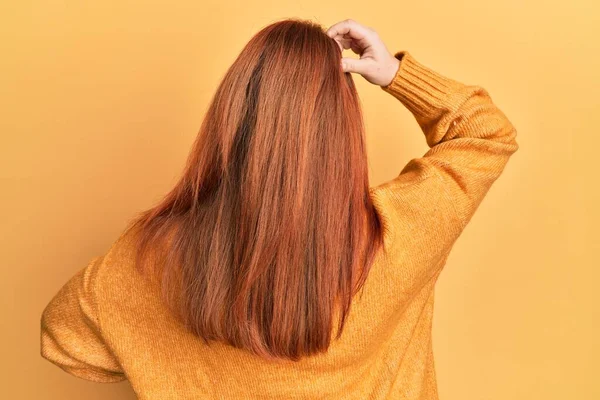 Beautiful Redhead Woman Wearing Casual Winter Sweater Yellow Background Backwards — Stock Photo, Image