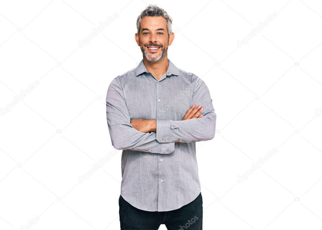 Middle age grey-haired man wearing casual clothes happy face smiling with crossed arms looking at the camera. positive person. 