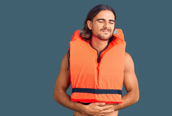 Young Handsome Man Wearing Nautical Lifejacket Hand Stomach Because Indigestion — Stock Photo, Image