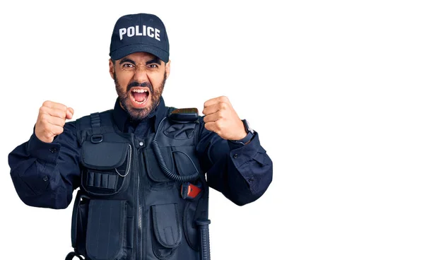 Young Hispanic Man Wearing Police Uniform Angry Mad Raising Fists — Stock Photo, Image